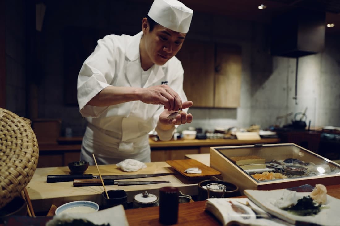 Chef at work behind an omakase counter
